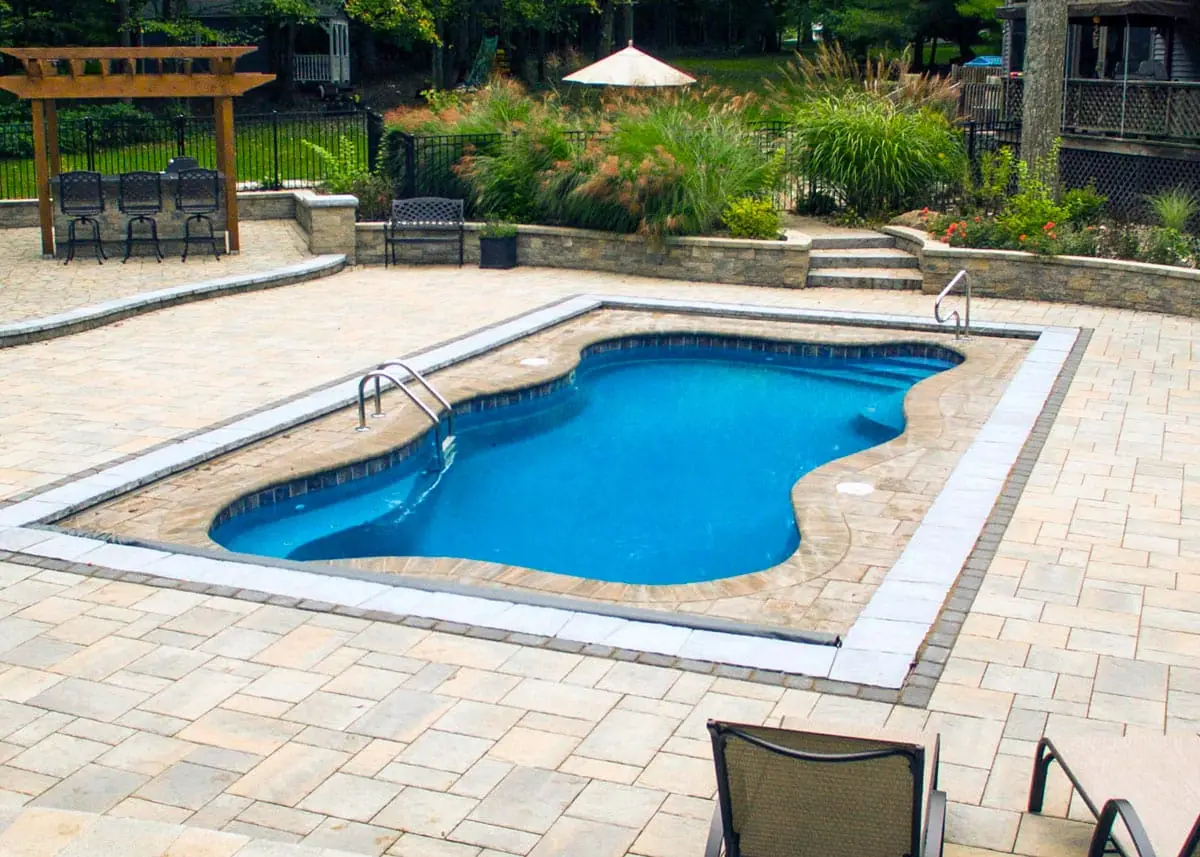 Cape Cod 12 freeform fiberglass pool installation, view 1