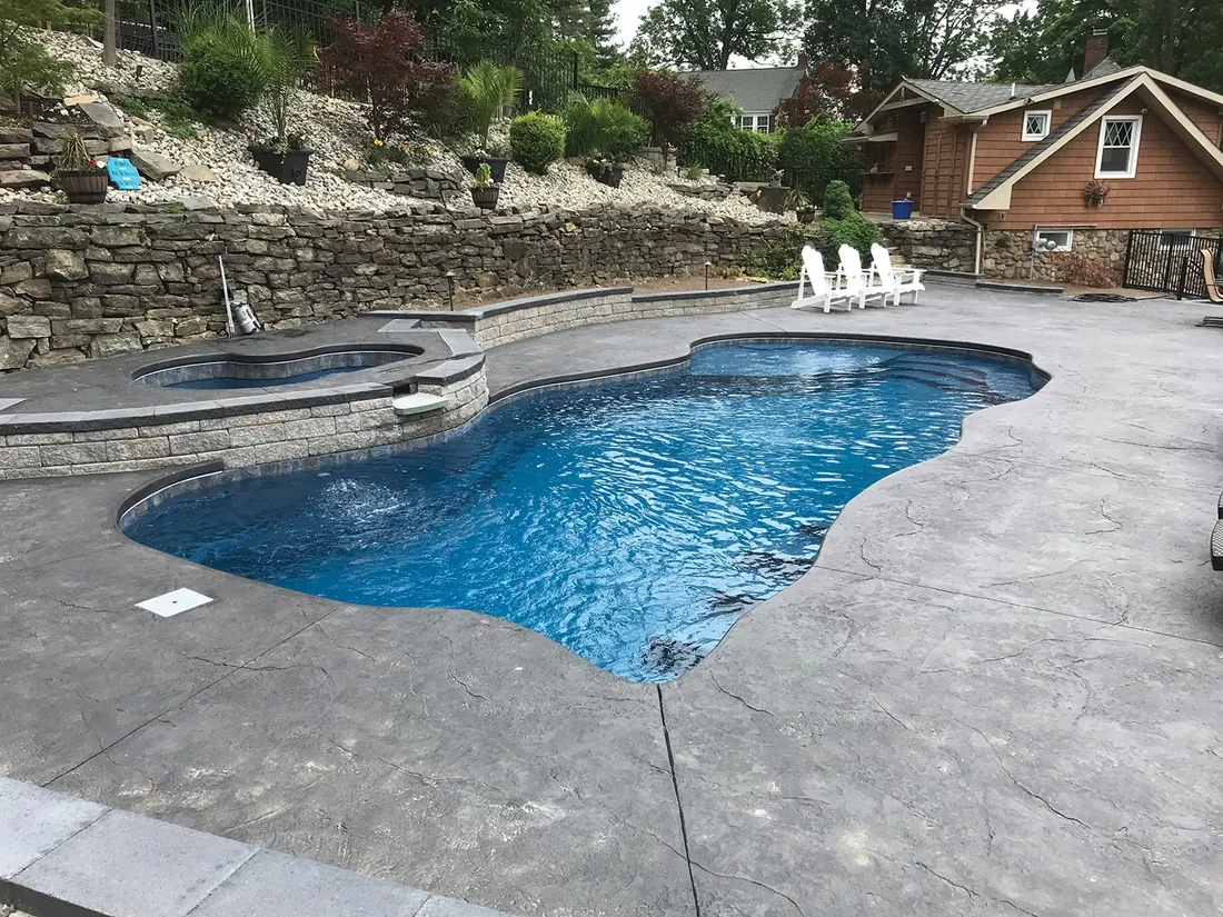 Freeform pool with a natural stone surround