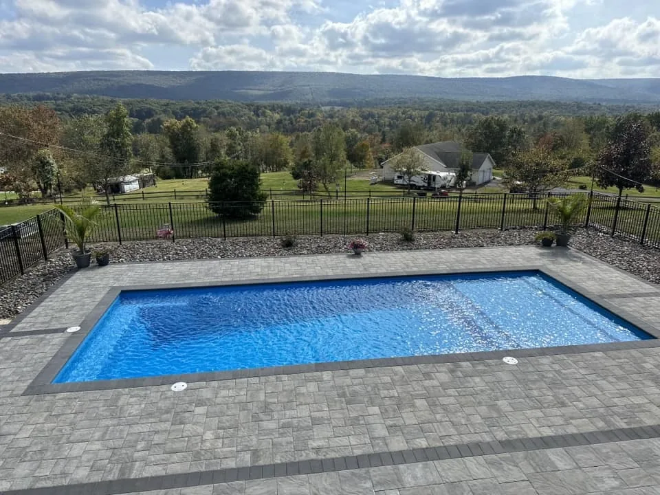 Rectangle pool in an open backyard