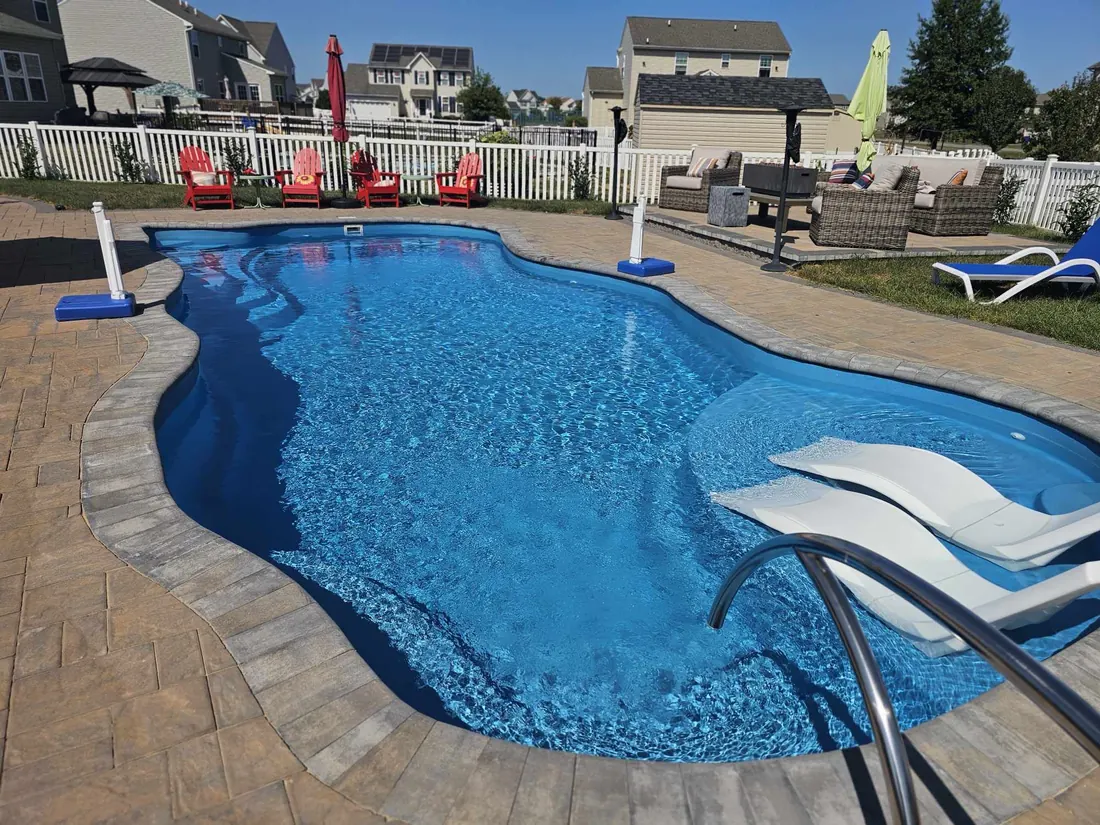 Freeform pool with a diving board